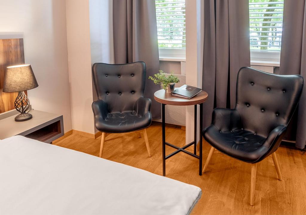 Postelja oz. postelje v sobi nastanitve Atelier Hotel