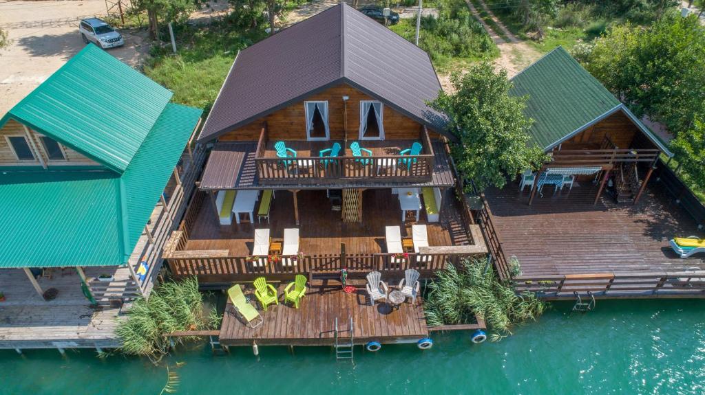 an aerial view of a house on the water at Hakuna Matata Apartments in Ulcinj