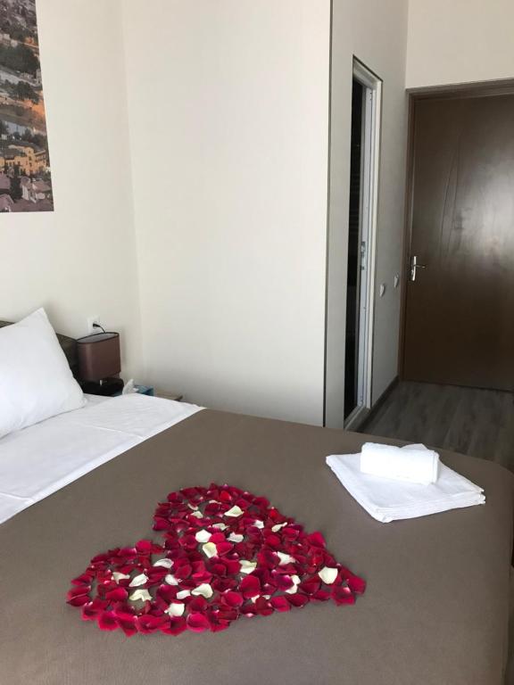 Postel nebo postele na pokoji v ubytování Sweet Rooms Inn