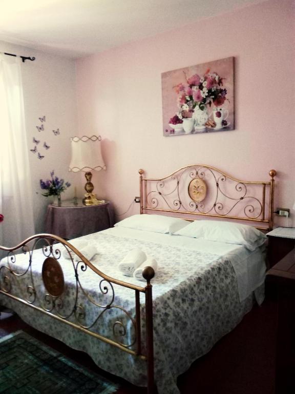 Postel nebo postele na pokoji v ubytování Bed and Breakfast Mimosa