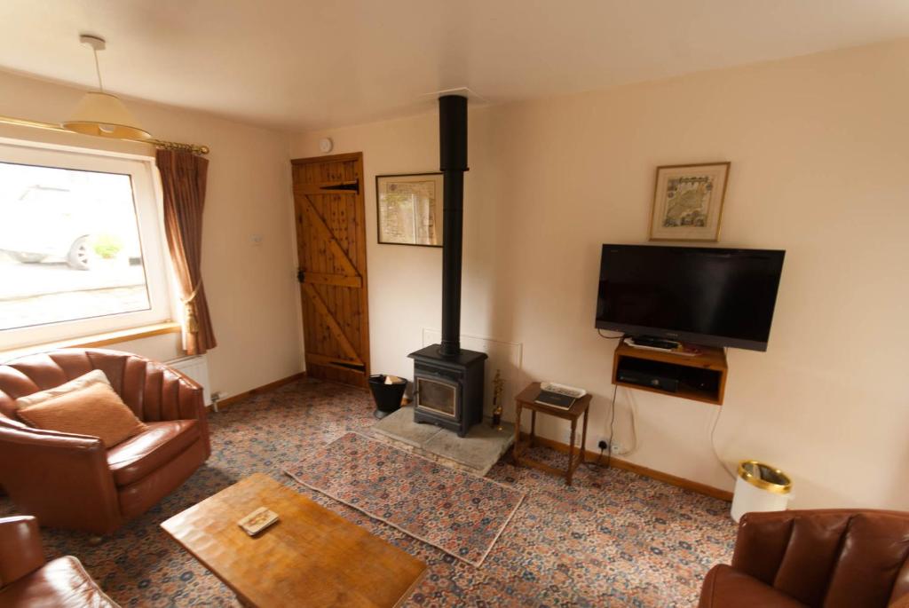 TV a/nebo společenská místnost v ubytování Greyfield Farm Cottages