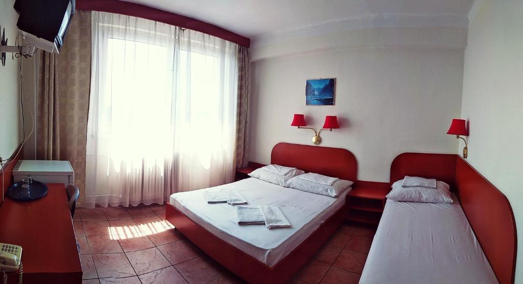 Postel nebo postele na pokoji v ubytování Hotel Nap