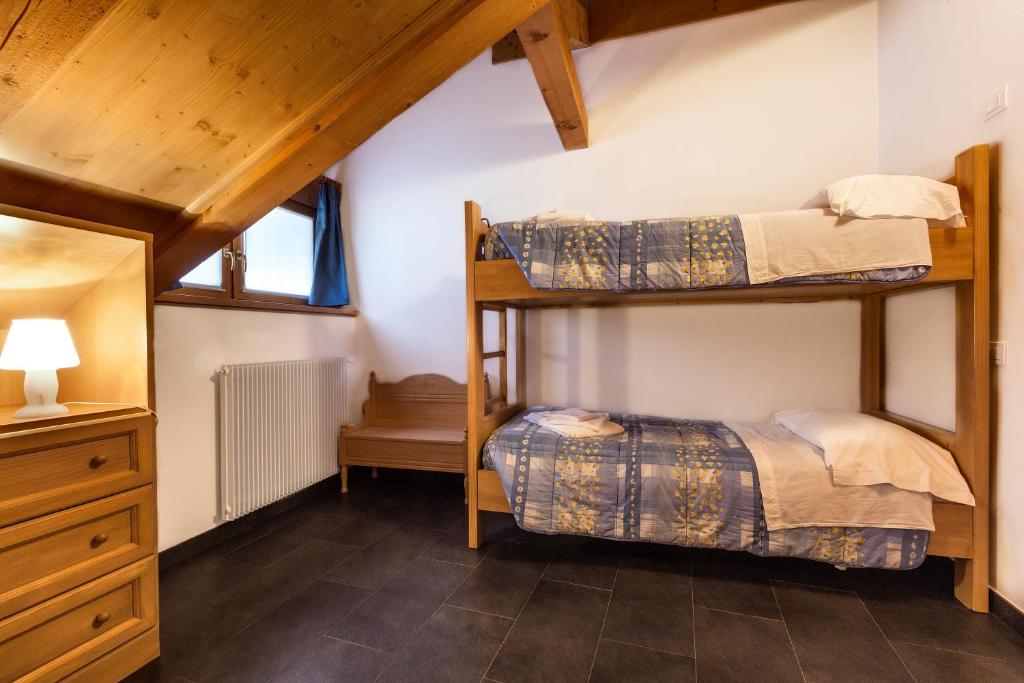 Letto o letti in una camera di Albergo Diffuso Sutrio Zoncolan