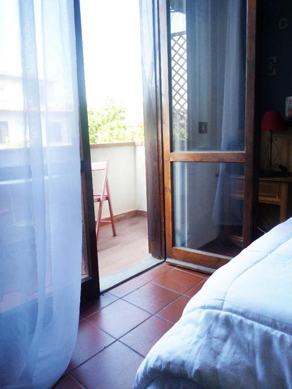 Postel nebo postele na pokoji v ubytování Bed and Breakfast Mimosa