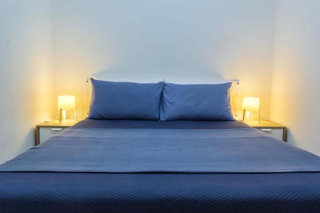 A bed or beds in a room at Nero D'Avola Morgante