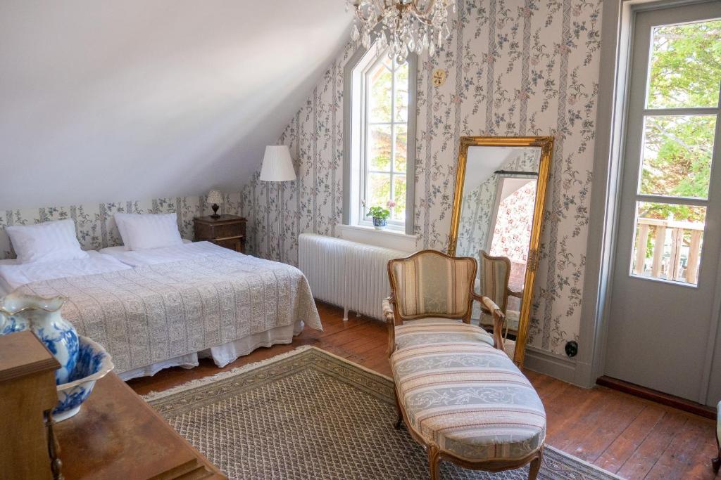Postel nebo postele na pokoji v ubytování Warfsholm