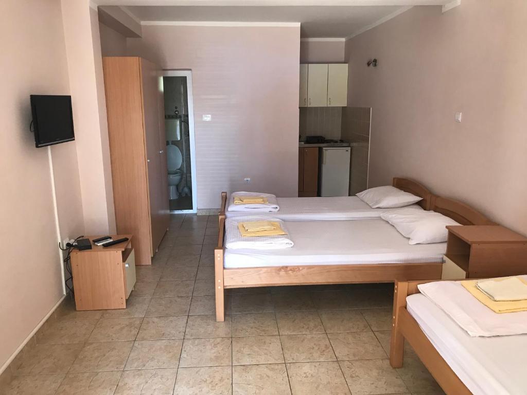 Postel nebo postele na pokoji v ubytování Apartmani Tomovic
