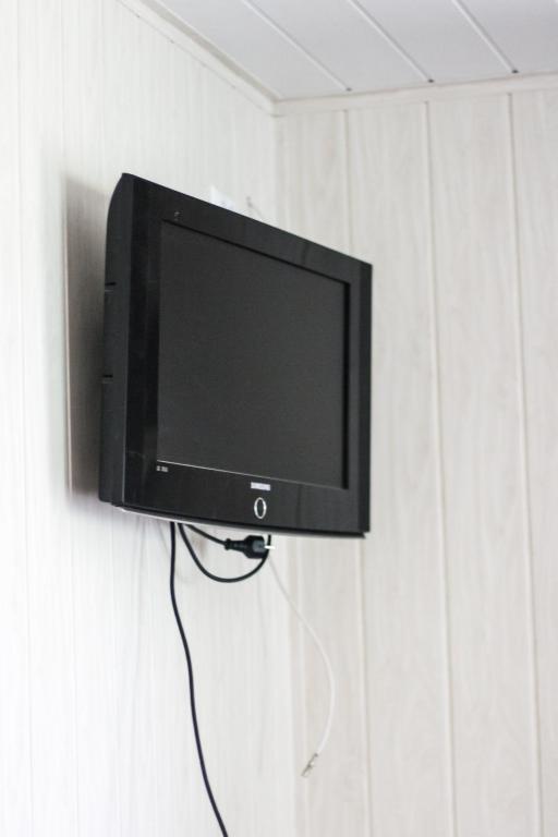 TV a/nebo společenská místnost v ubytování Rotušė