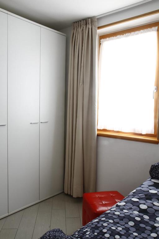 Łóżko lub łóżka w pokoju w obiekcie Adamello Brenta Sunshine