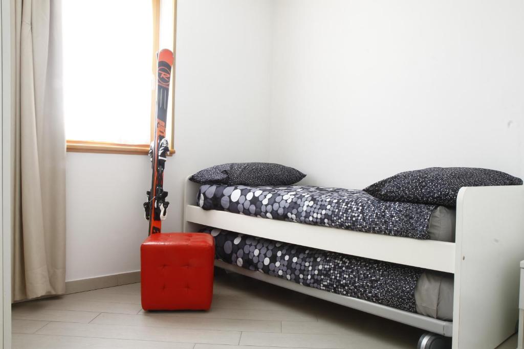 Łóżko lub łóżka w pokoju w obiekcie Adamello Brenta Sunshine