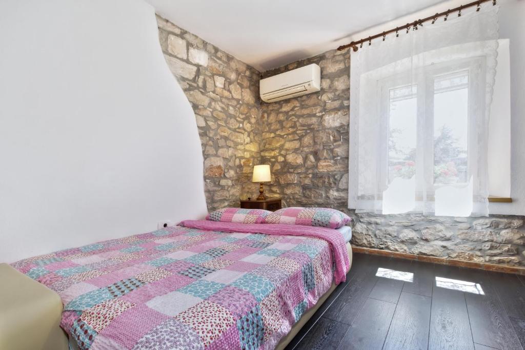 Postel nebo postele na pokoji v ubytování Apartmani Anna