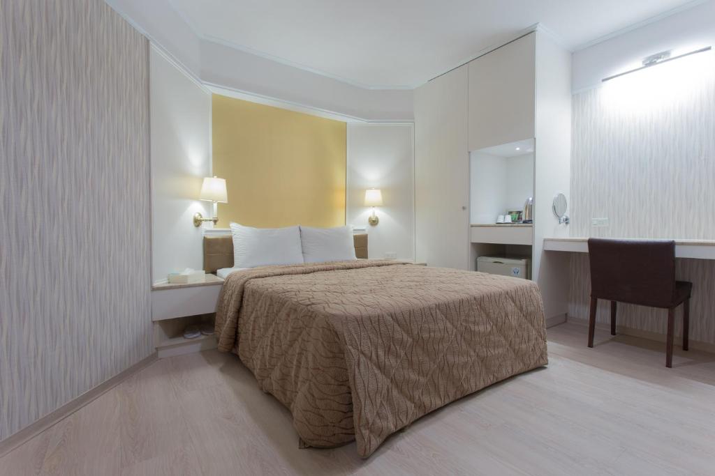 Postel nebo postele na pokoji v ubytování Monalisa Hotel