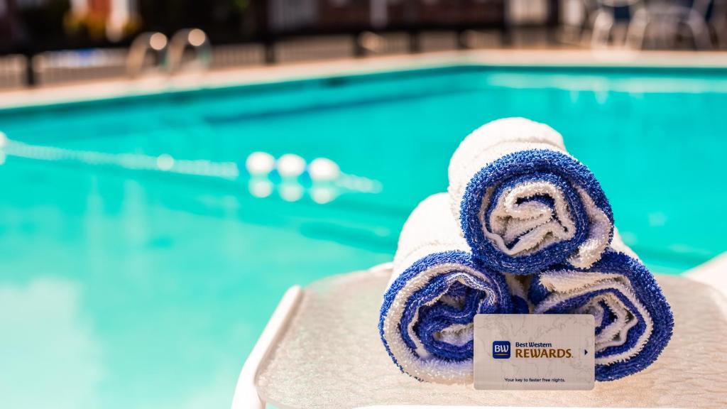 a rolled up towel next to a swimming pool at Best Western Horizon Inn in Medford
