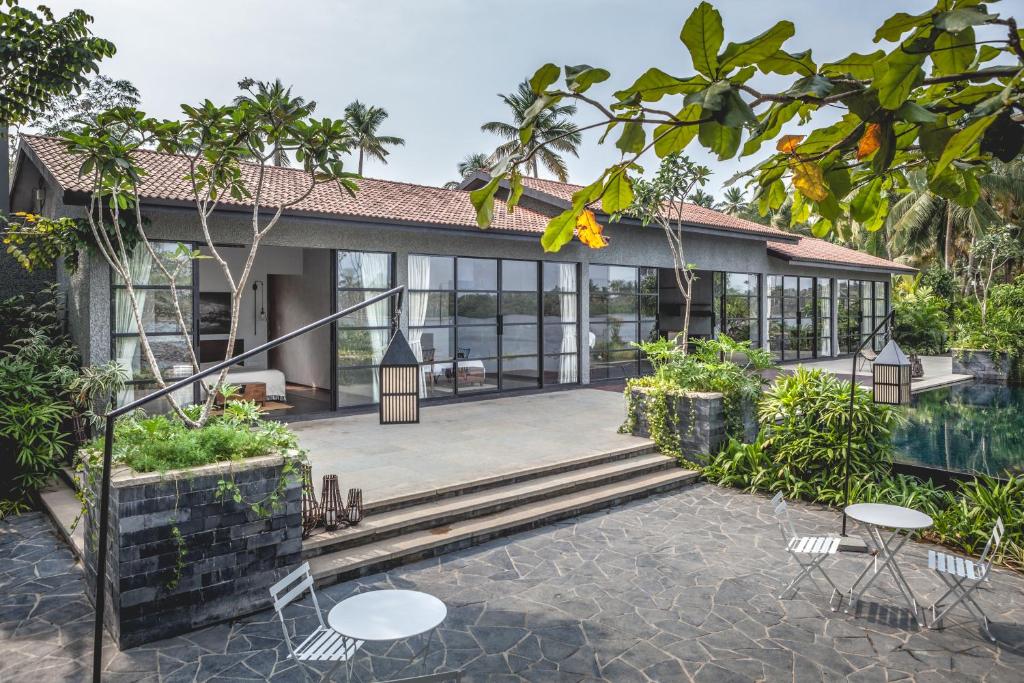 an exterior view of a house with a courtyard at 976 Panangad in Cochin