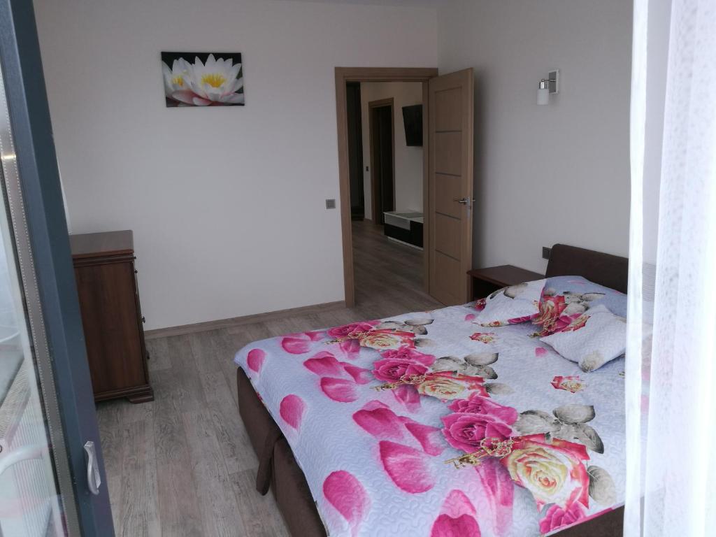 Postel nebo postele na pokoji v ubytování Ąžuolo apartamentai