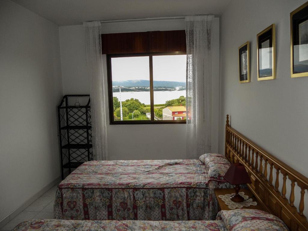 Posteľ alebo postele v izbe v ubytovaní Apartamentos Blanco