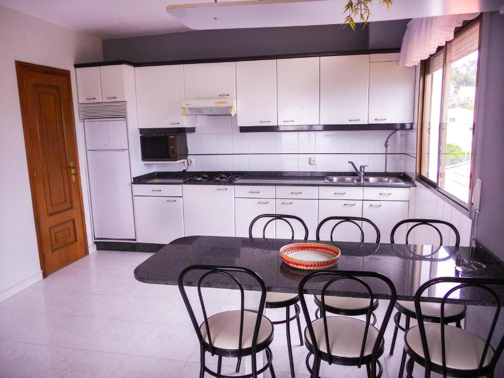 Kuchyňa alebo kuchynka v ubytovaní Apartamentos Blanco