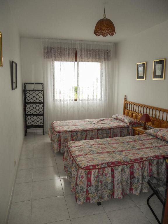 Posteľ alebo postele v izbe v ubytovaní Apartamentos Blanco