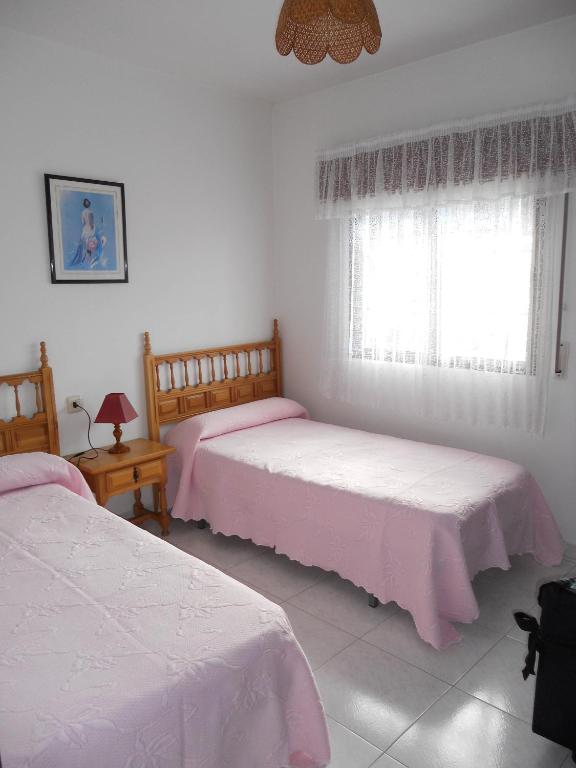 Posteľ alebo postele v izbe v ubytovaní Apartamentos Blanco