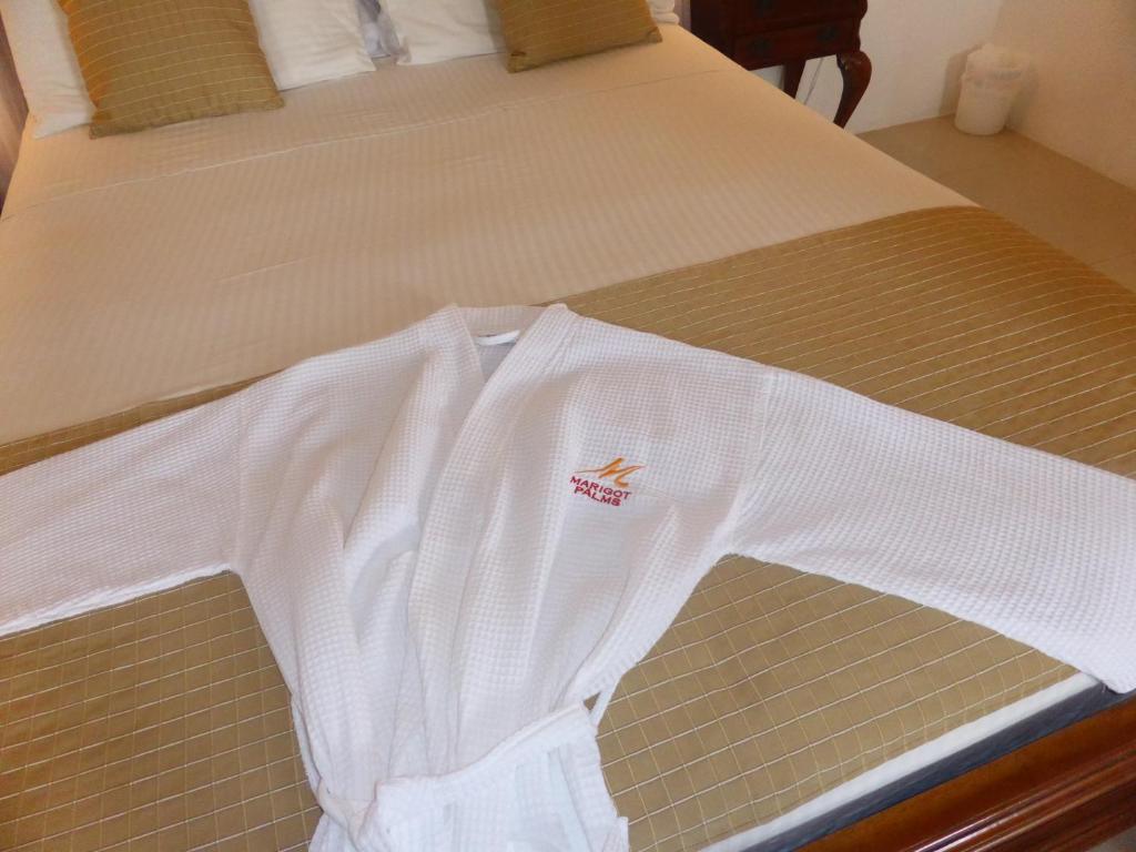 Кровать или кровати в номере Marigot Palms Luxury Caribbean Apartment Suites