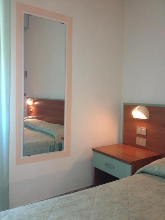 Postel nebo postele na pokoji v ubytování Hotel Rivamare