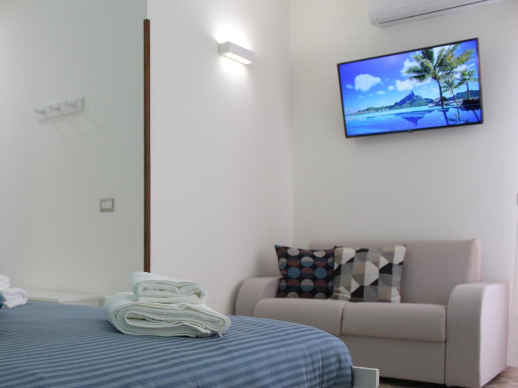 Postel nebo postele na pokoji v ubytování La Chiave Rossa B&B