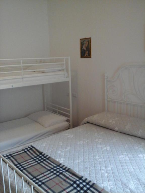 Postel nebo postele na pokoji v ubytování Casa Zia Adry