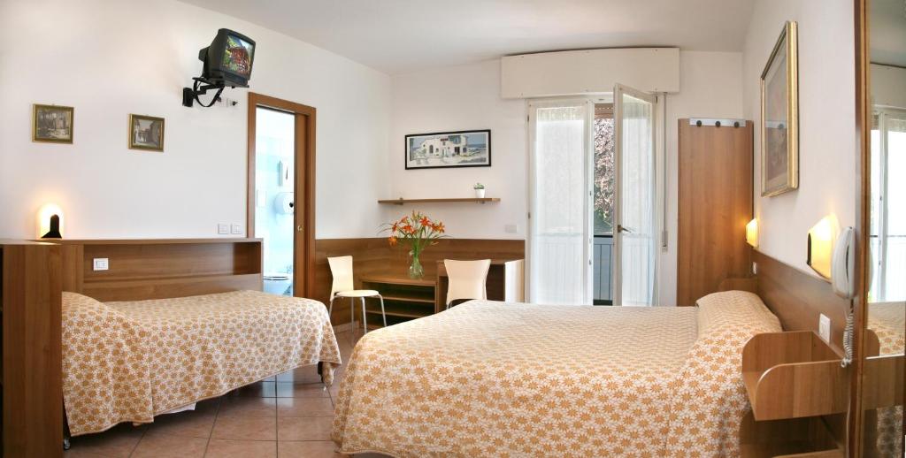 Postel nebo postele na pokoji v ubytování Hotel Baitone - Nature Village