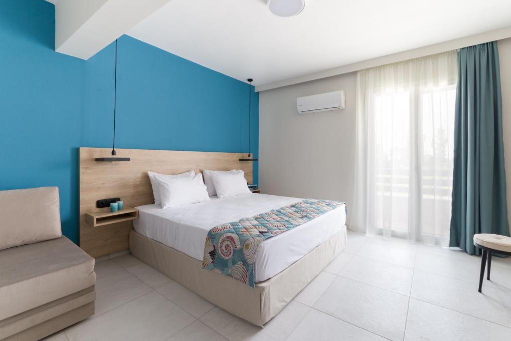 Postel nebo postele na pokoji v ubytování Mythic Summer Hotel
