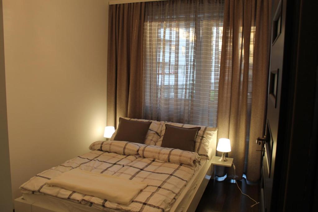 Posteľ alebo postele v izbe v ubytovaní Apartament Antoniukowska 60