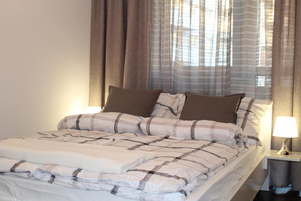 Posteľ alebo postele v izbe v ubytovaní Apartament Antoniukowska 60