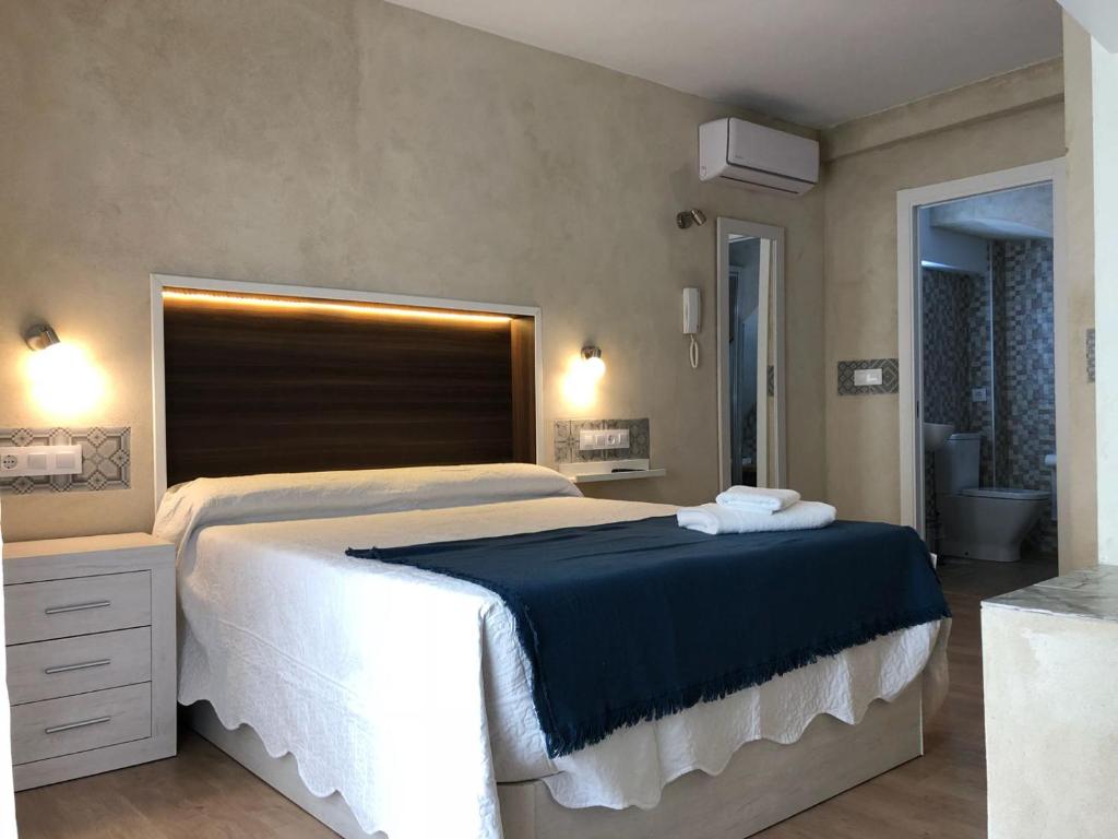 Postel nebo postele na pokoji v ubytování LA Isla de Mirabel