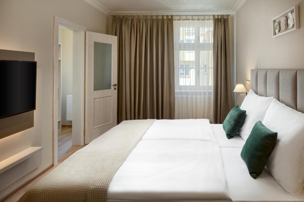 Postel nebo postele na pokoji v ubytování Louren Apartments