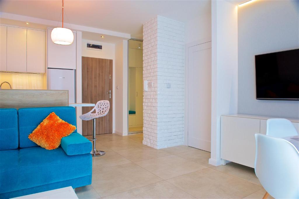 Televízia a/alebo spoločenská miestnosť v ubytovaní Sea Cliff Apartment Rewal