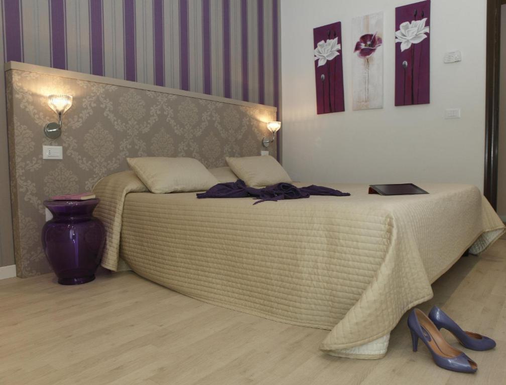 Postel nebo postele na pokoji v ubytování Hotel Principe