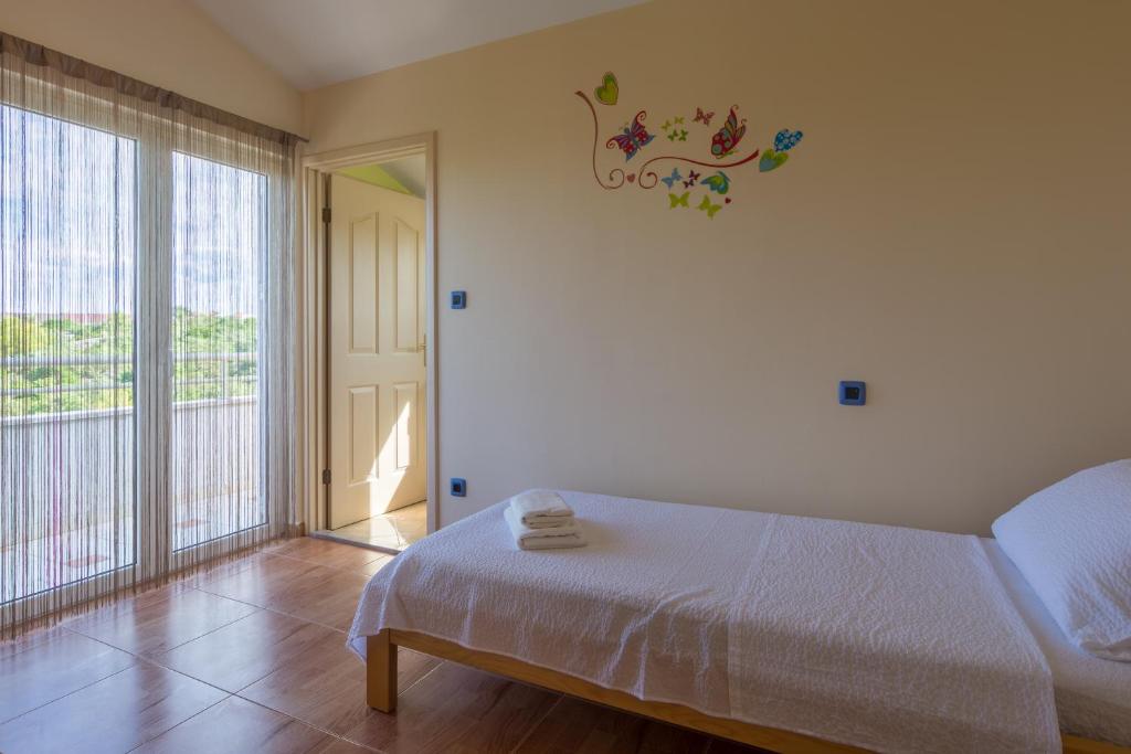 Posteľ alebo postele v izbe v ubytovaní Holiday Home Matela