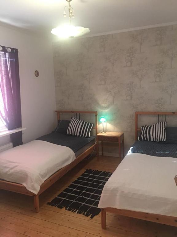 Postel nebo postele na pokoji v ubytování Kolstigenhus
