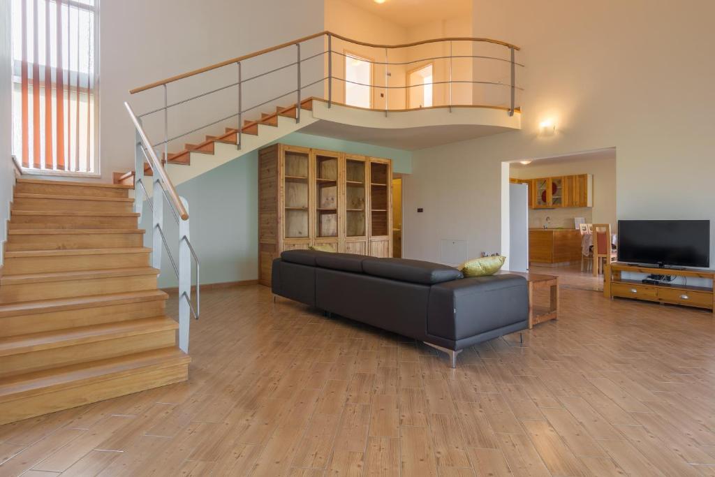 Televízia a/alebo spoločenská miestnosť v ubytovaní Holiday Home Matela