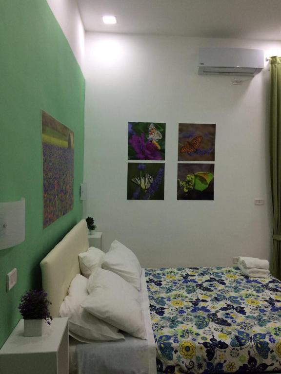 A bed or beds in a room at Decumani Prestige