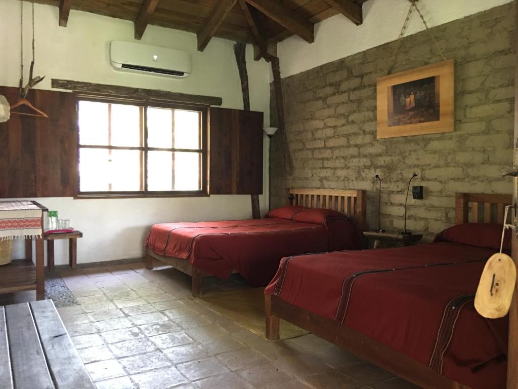 Postel nebo postele na pokoji v ubytování Hotel Hacienda San Lucas