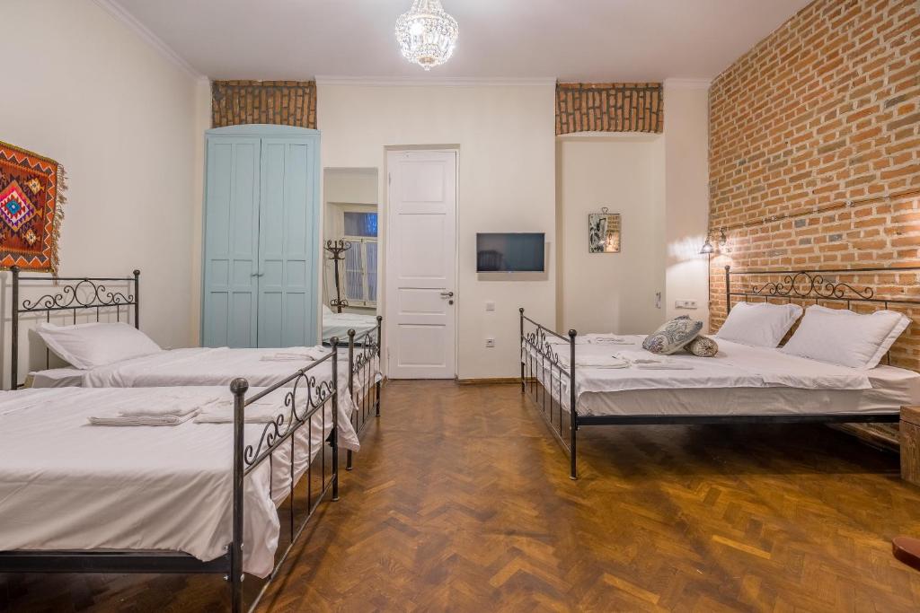 Postel nebo postele na pokoji v ubytování Doors Meidan Design Hotel