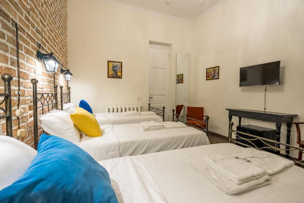 Postel nebo postele na pokoji v ubytování Doors Meidan Design Hotel