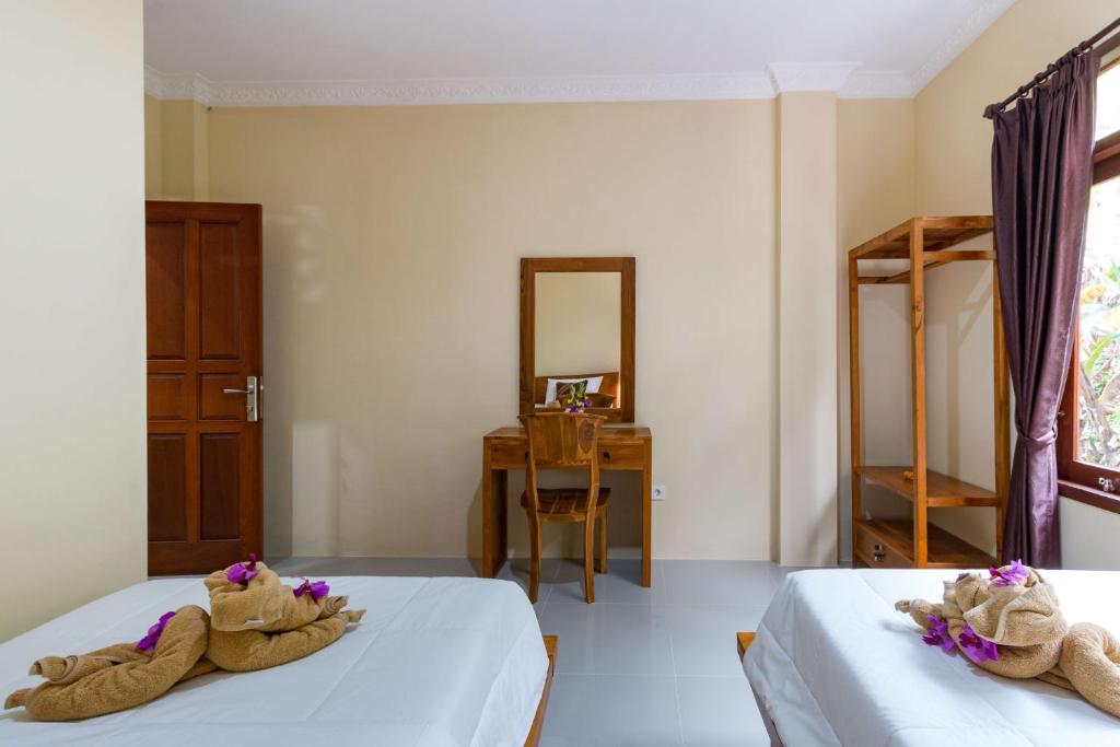 Postel nebo postele na pokoji v ubytování Alam Pangkung Ubud
