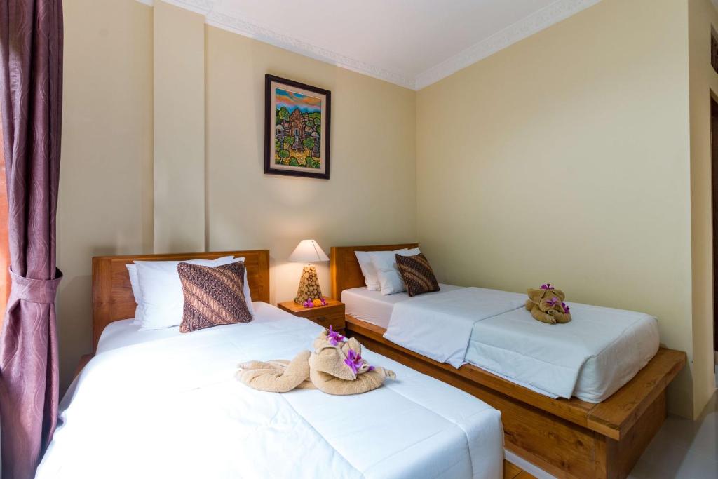 Postel nebo postele na pokoji v ubytování Alam Pangkung Ubud