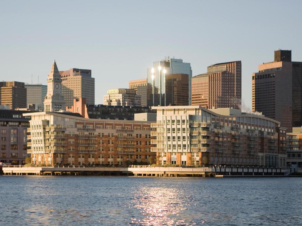 a view of a city from the water with buildings at Battery Wharf Hotel, Boston Waterfront in Boston