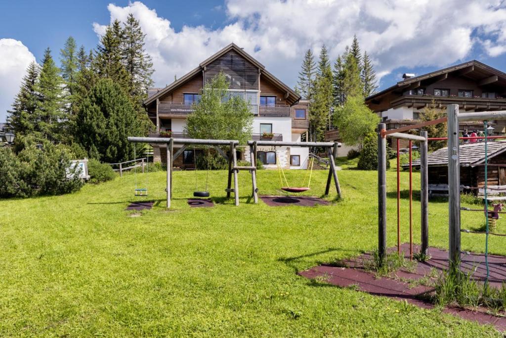 a playground in the yard of a house at Das Penthaus Katschberg in Katschberghöhe