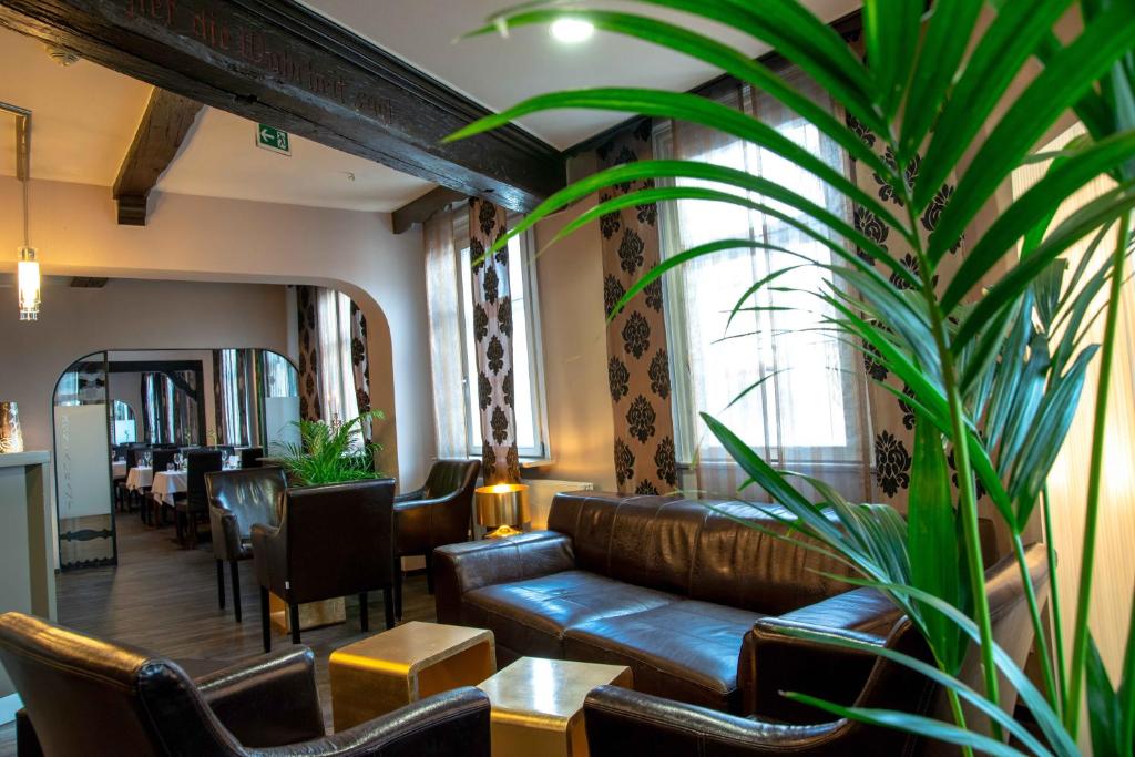 Ein Sitzbereich in der Unterkunft Hotel Engel
