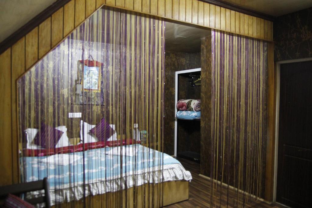 Postel nebo postele na pokoji v ubytování Vamoose Mandarin Village Resort