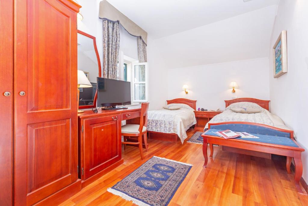 Postel nebo postele na pokoji v ubytování Hotel Ostrea