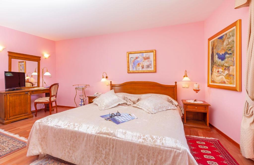 Postel nebo postele na pokoji v ubytování Hotel Ostrea
